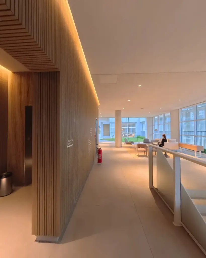 Biotique corridor, with the wall clad in timber slats